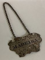 A Victorian silver wine label for 'Madeira'.