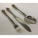 A Victorian silver three-piece Apostle christening set.