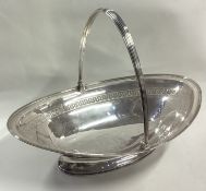 A large George III silver swing handled basket.