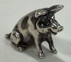 A contemporary silver figure of a pig.