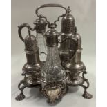 A silver Warwick cruet set complete with original casters and bottles.