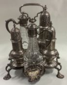 A silver Warwick cruet set complete with original casters and bottles.