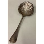 An 18th Century French silver clam server with central armorial to terminal.