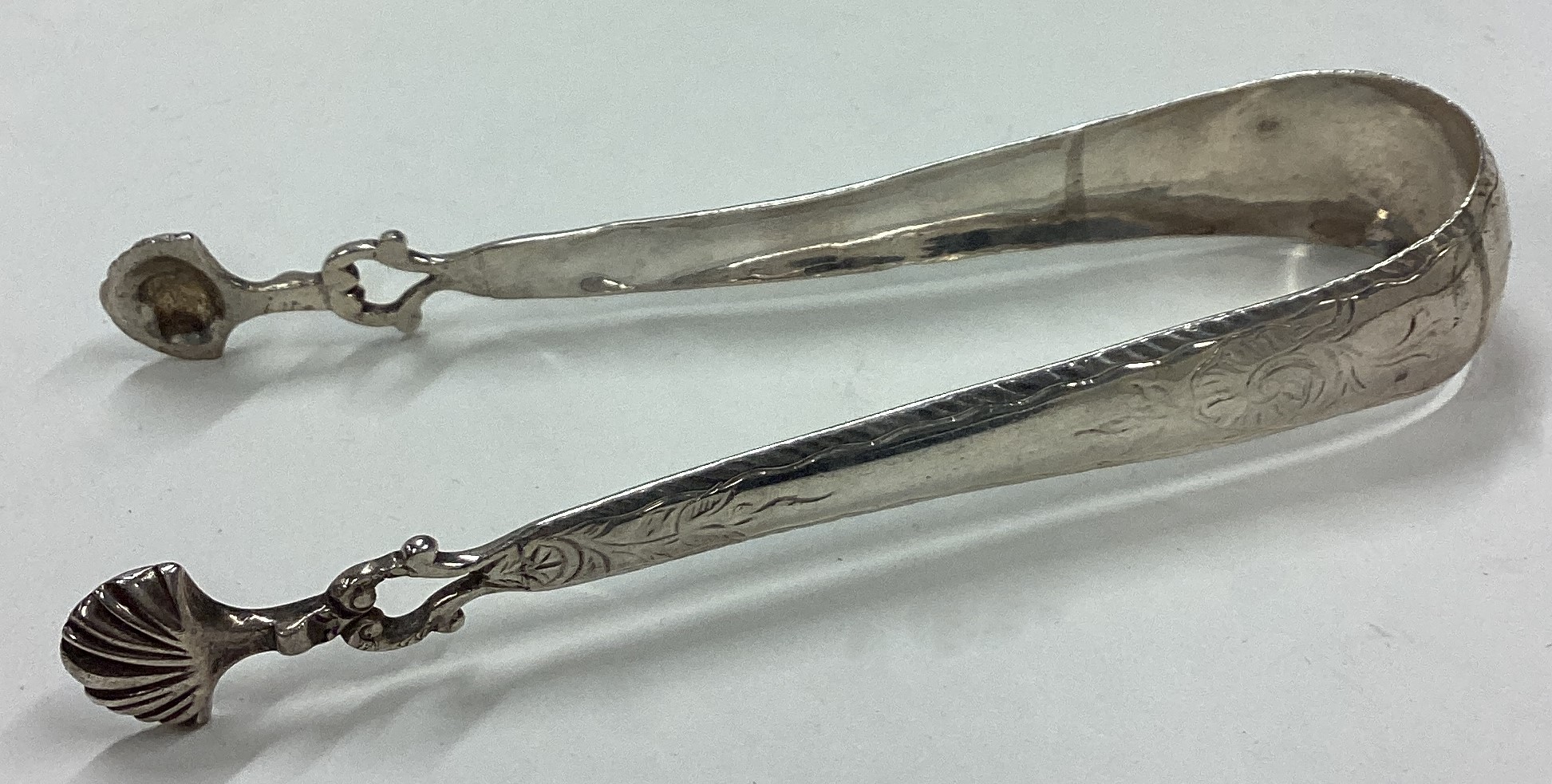 A pair of 18th Century silver ice tongs.