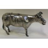 A 19th Century Continental silver creamer in the form of a cow.