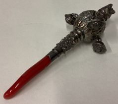 A 19th Century silver rattle.