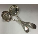A matched pair of pierced silver sifter spoons.