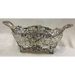 A fine Victorian silver basket with pierced decoration.