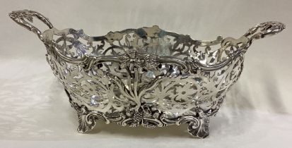 A fine Victorian silver basket with pierced decoration.