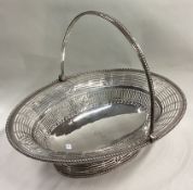 A large and fine 18th Century George III silver swing handled basket.