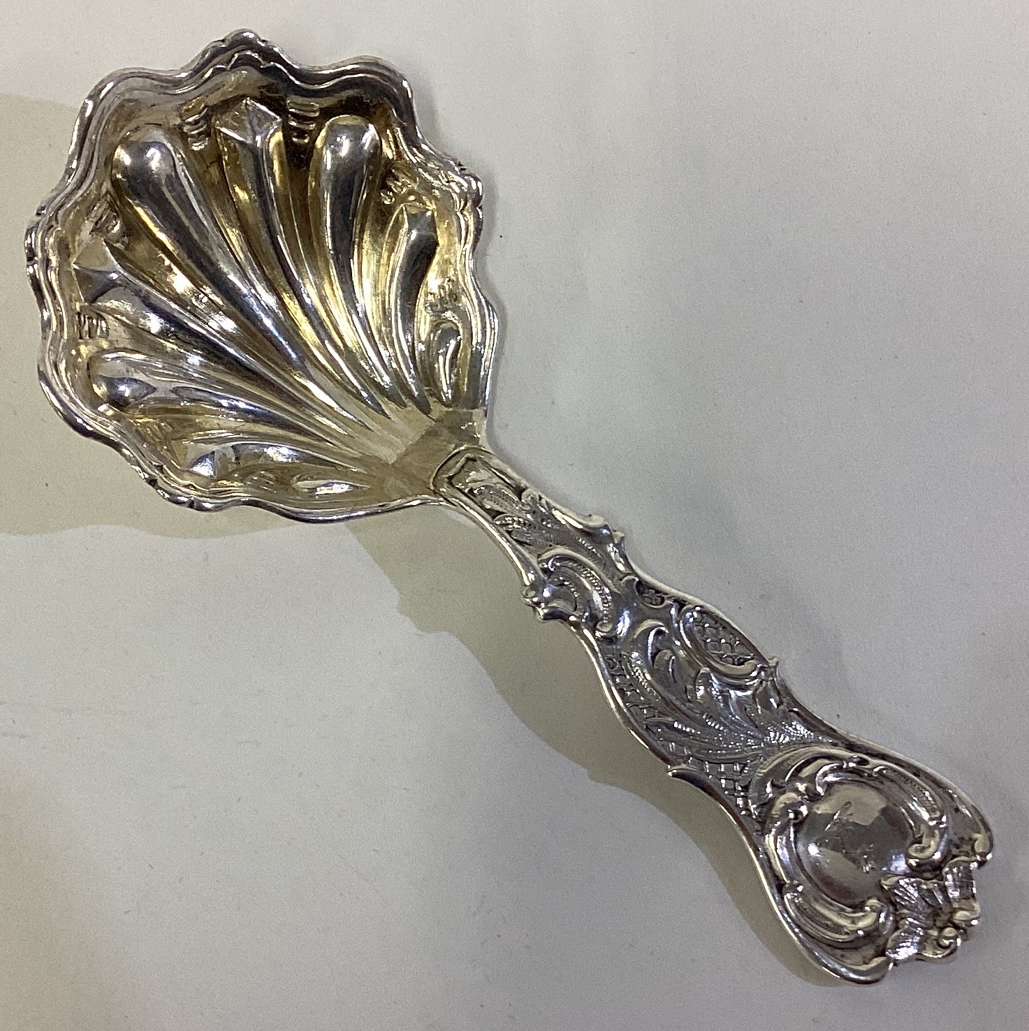 A rare naturalistic Victorian silver caddy spoon.