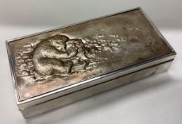 A rare Japanese silver cigar box with gilt cover.