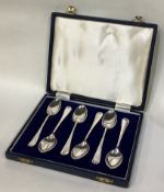A good boxed set of six silver OE pattern picture back teaspoons.