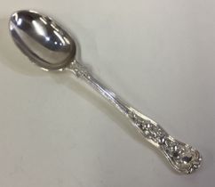 A silver rose pattern spoon. London 1985.