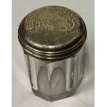 A William IV silver gilt and glass jar with bright-cut decoration.
