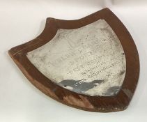 A large silver mounted plaque.