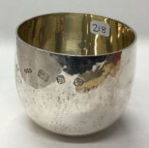 A contemporary silver tumbler cup.