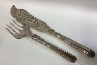 A fine pair of Victorian silver fish servers.
