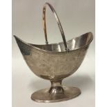 An 18th Century George III silver basket with bright-cut decoration.