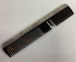 LIBERTY & CO: A silver comb.