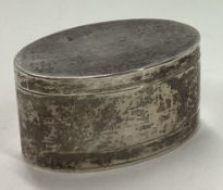 A heavy silver pill box with lift-off cover.