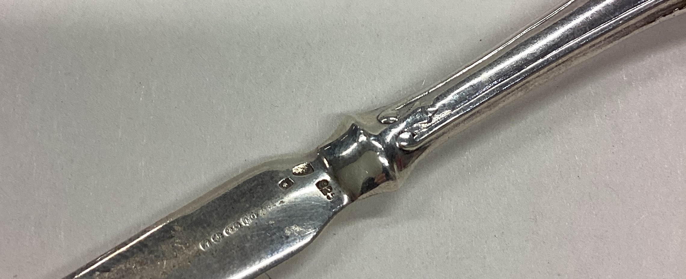 A silver letter opener bearing import marks. - Image 2 of 2