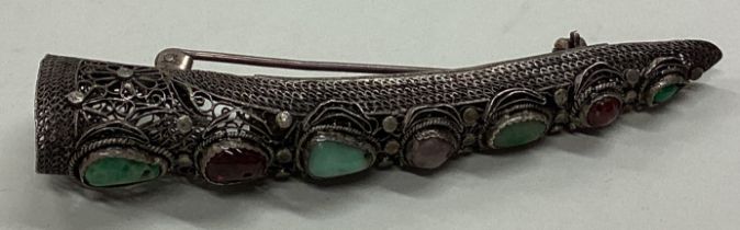 A rare large silver and stone brooch with filigree decoration.