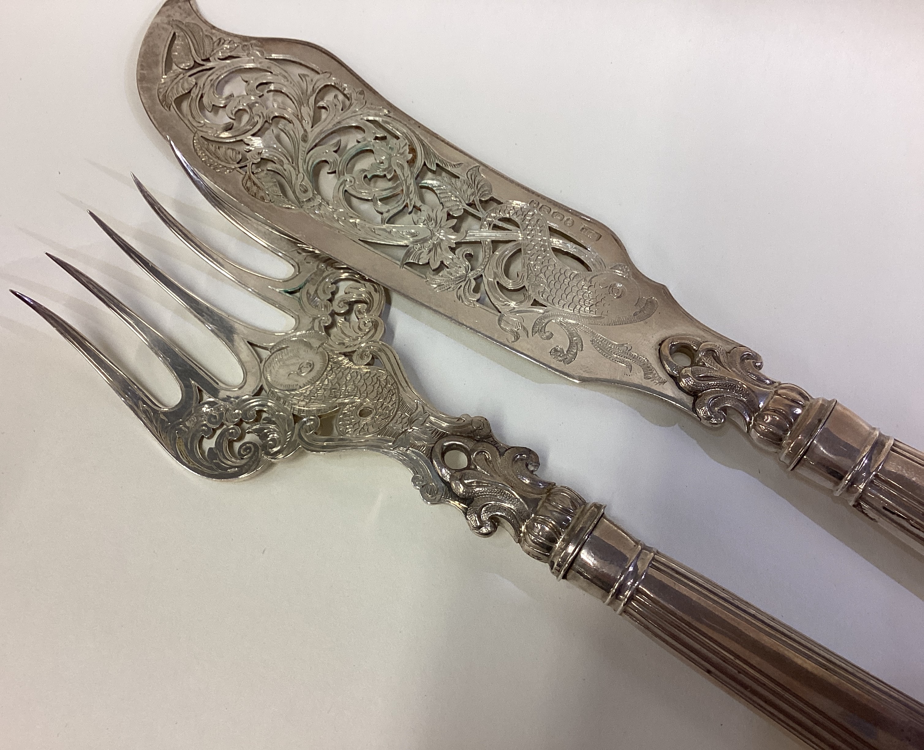 A fine pair of Victorian silver fish servers. - Image 2 of 2