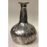 An American silver vase in the Japanese style embossed with chrysanthemum decoration.