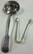 A silver fiddle pattern sauce ladle together with a pair of tongs.