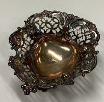 A Victorian silver heart shaped dish with pierced decoration.