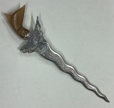 A rare silver letter opener with unusual handle.