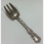 An American silver pastry fork.