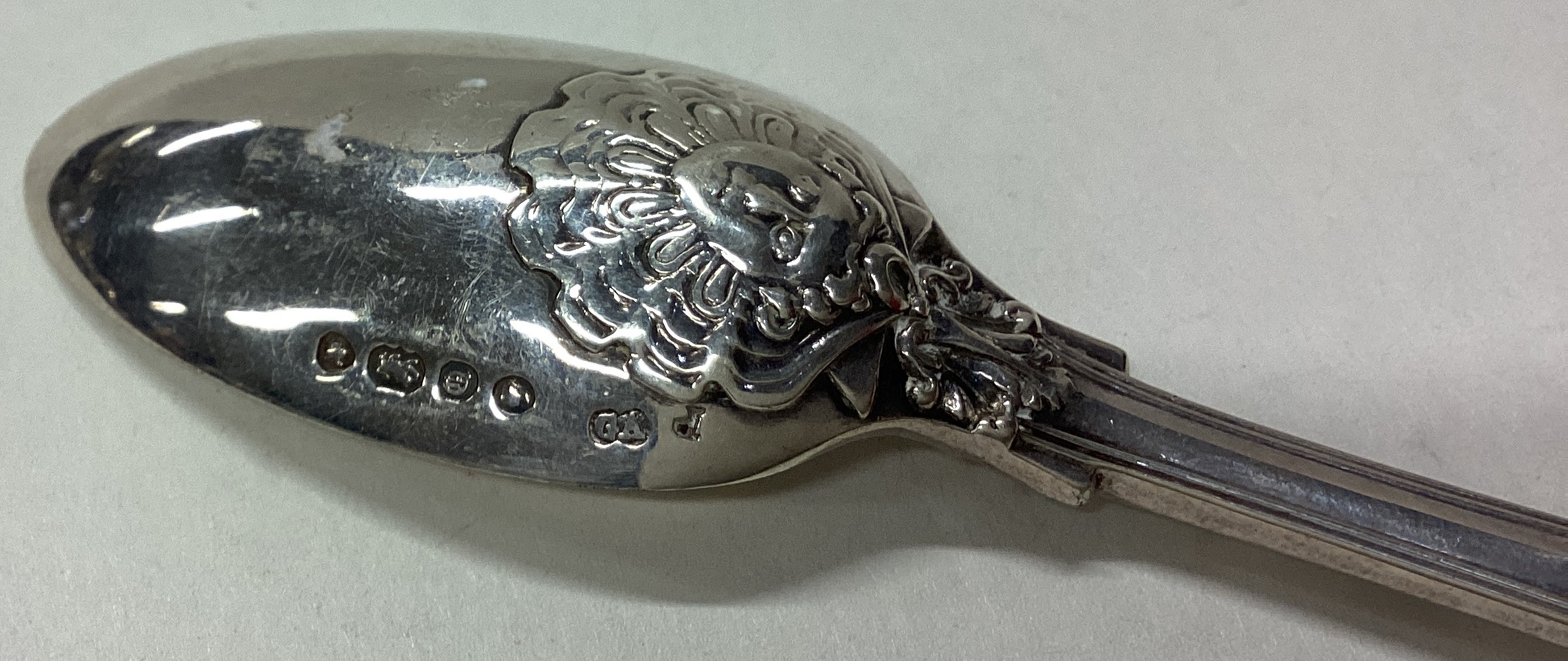 A Victorian silver spoon embossed with hunting scene. - Image 2 of 2
