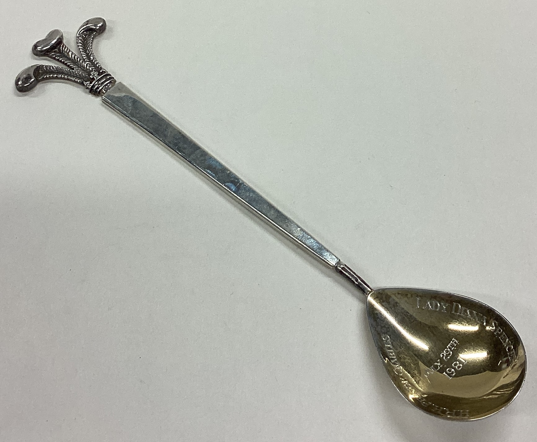 A large silver spoon commemorating the Prince of Wales.