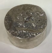 A heavy Modernistic silver box with unusual decorated lid.