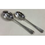 A rare silver picture back spoon together with a fluted spoon.