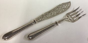 A pair of Victorian silver servers.