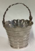A silver cream pail in the 18th Century style.