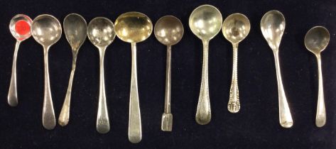 A large group of silver OE pattern salt spoons.