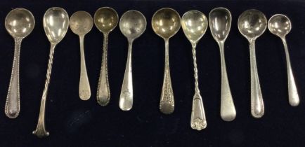 A large collection of silver bead and other pattern salt spoons.