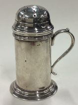 A Victorian silver kitchen pepper. London 1886.