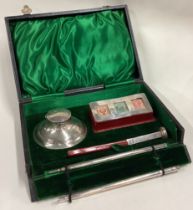 A rare novelty silver desk set comprising of triple stamp case, inkwell and ink pen.