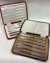 Two cased silver handled knife sets.