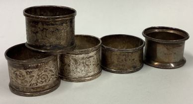 A set of five heavy silver napkin rings.