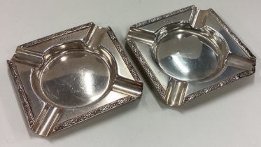 A pair of Art Deco silver ash trays.