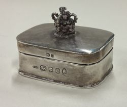 A silver box with lift-off lid decorated with crown finial commemorating the Jubilee.