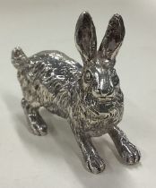 A heavy silver figure of a rabbit.