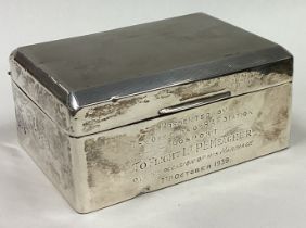 A good hinged top silver cigarette case with engine turned decoration.