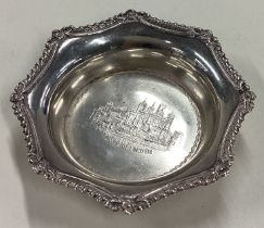 A silver bon bon dish depicting the Tower of London.